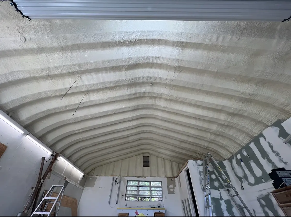 Spray polyurethane foam applied to the underside of a metal roof deck in Hillcrest Heights
